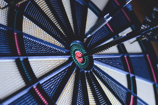 dart board sympolizing how niche marketing materials and social media strategies can lead to a successful brand