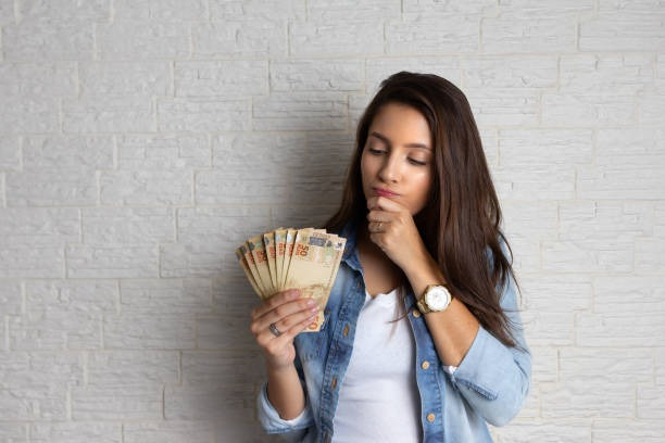 Woman holding her salary
