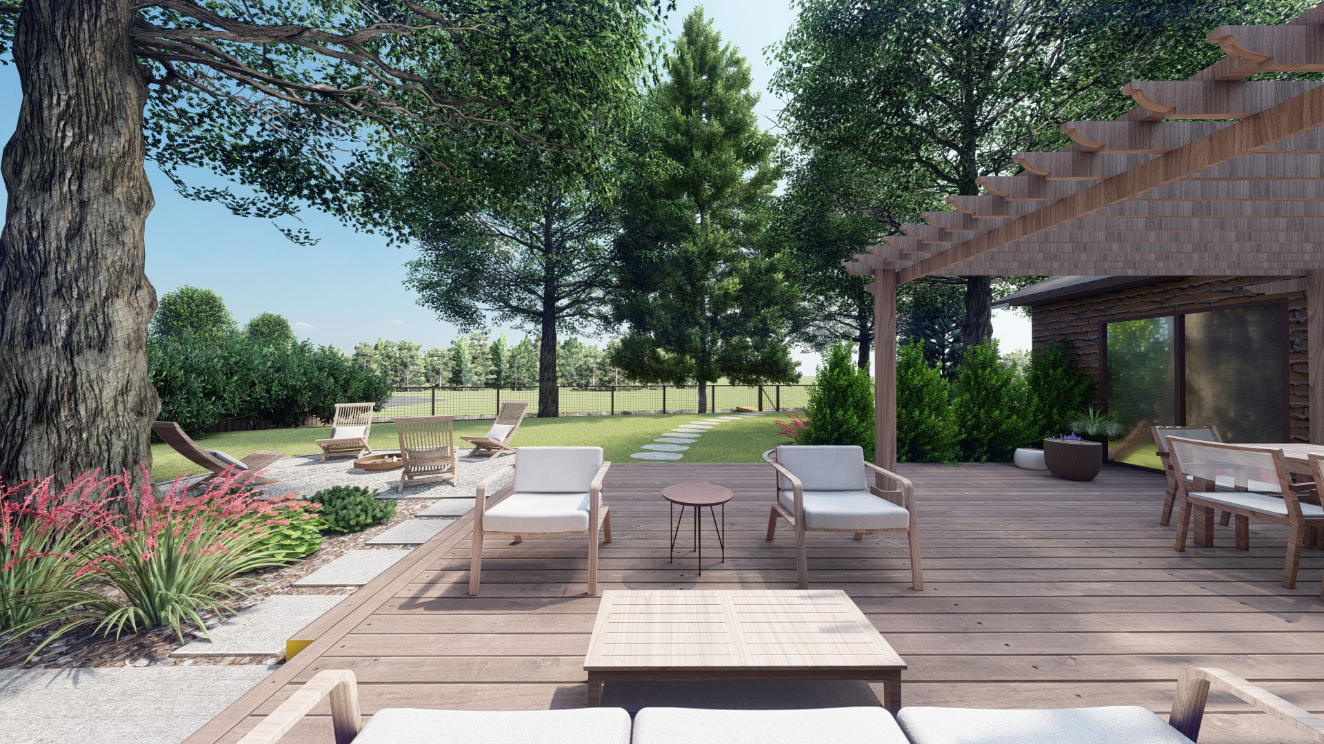 A large wood deck next to a gravel fire pit area