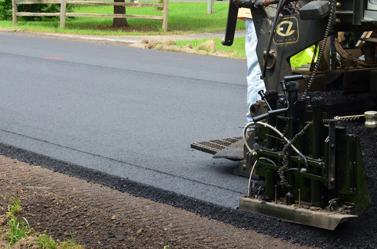 A paver working on a successful asphalt paving project