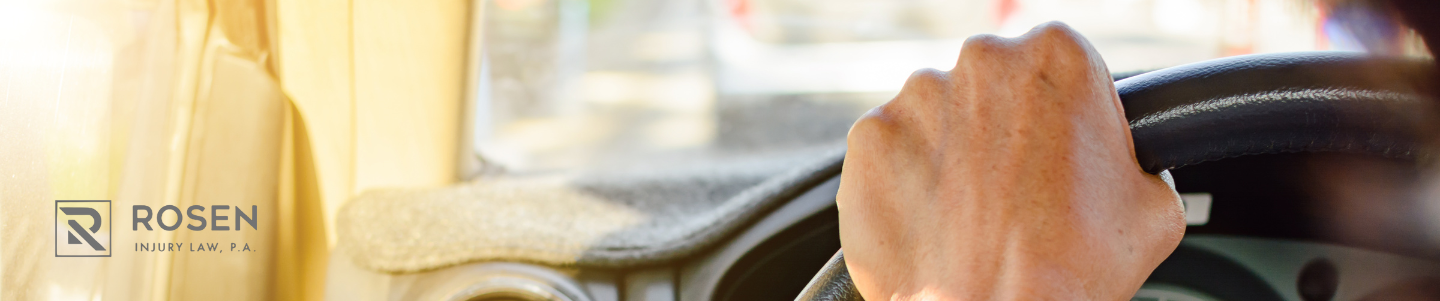 hands on a steering wheel to avoid distracted driving and chain reaction crashes.