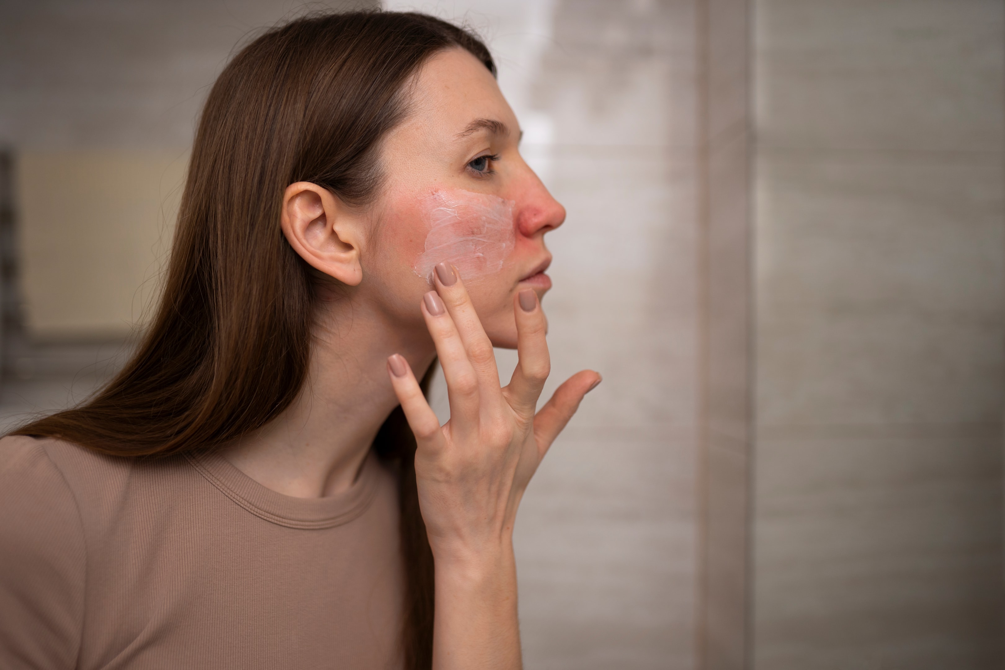 Source: Freepik  | Woman touching her face..