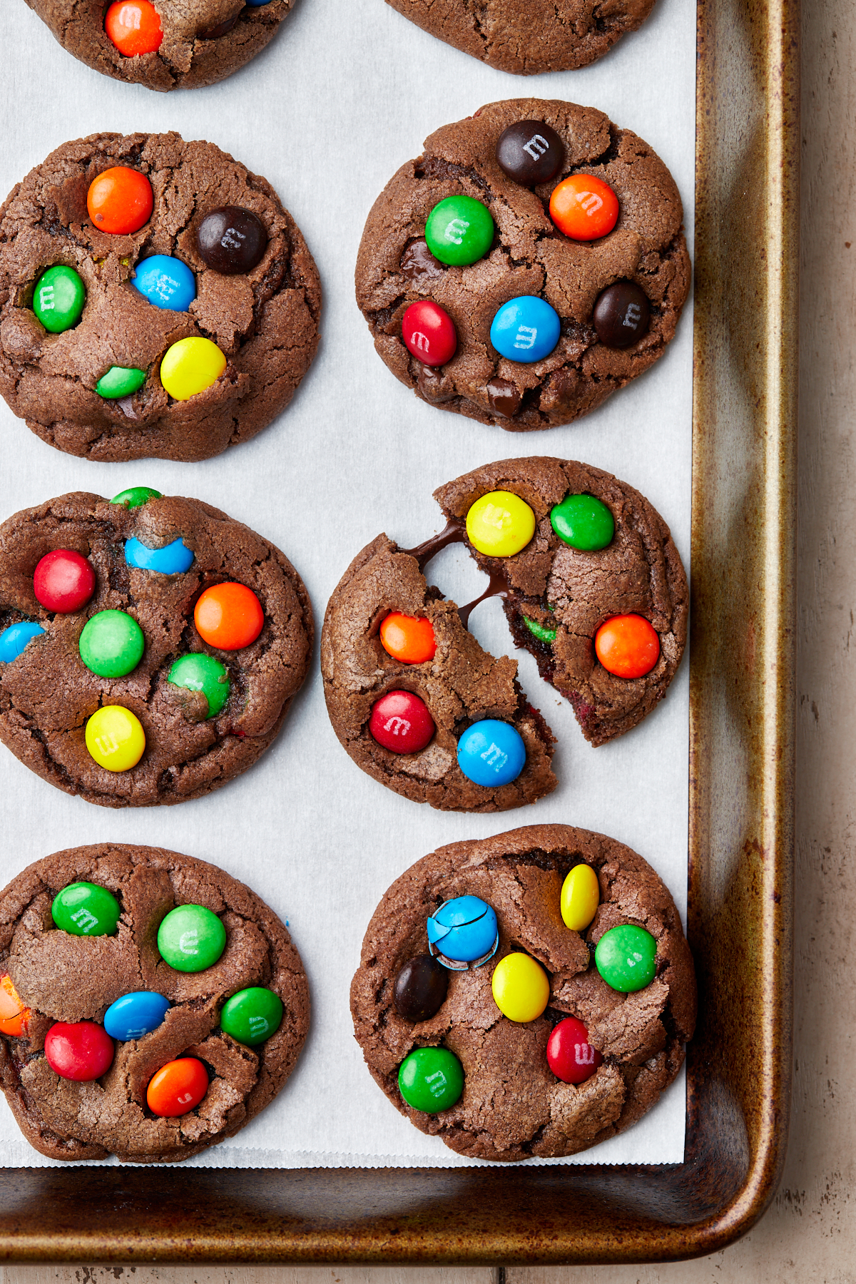 baked chocolate M&M cookies on a cookie sheet