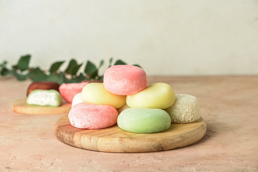 Colorful mochi on a wooden tray