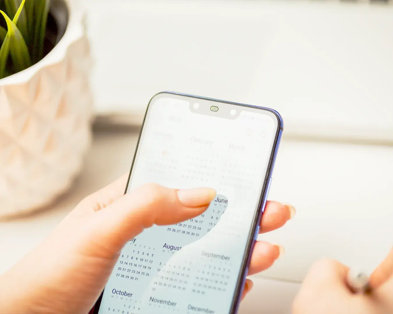 Smartphone showing restaurant content planning and influencer marketing calendar