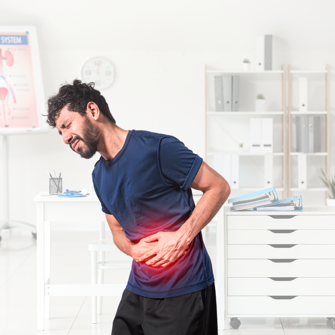 Man with stomach pain, in doctor's office