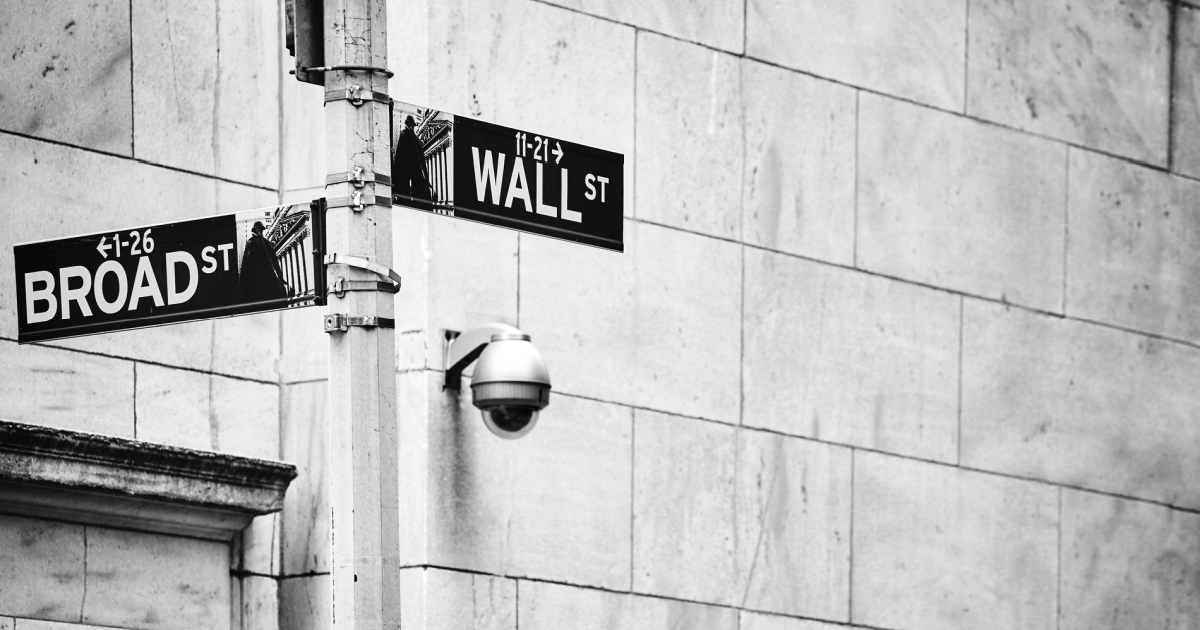 Image of Wall Street in Lower Manhattan, symbolizing the highs and lows of adult children's experiences with narcissistic parents who claim their successes and blame them for failures, akin to the fluctuating bull and bear markets - Schema therapy at Loving at Your Best Plan addresses these challenges.