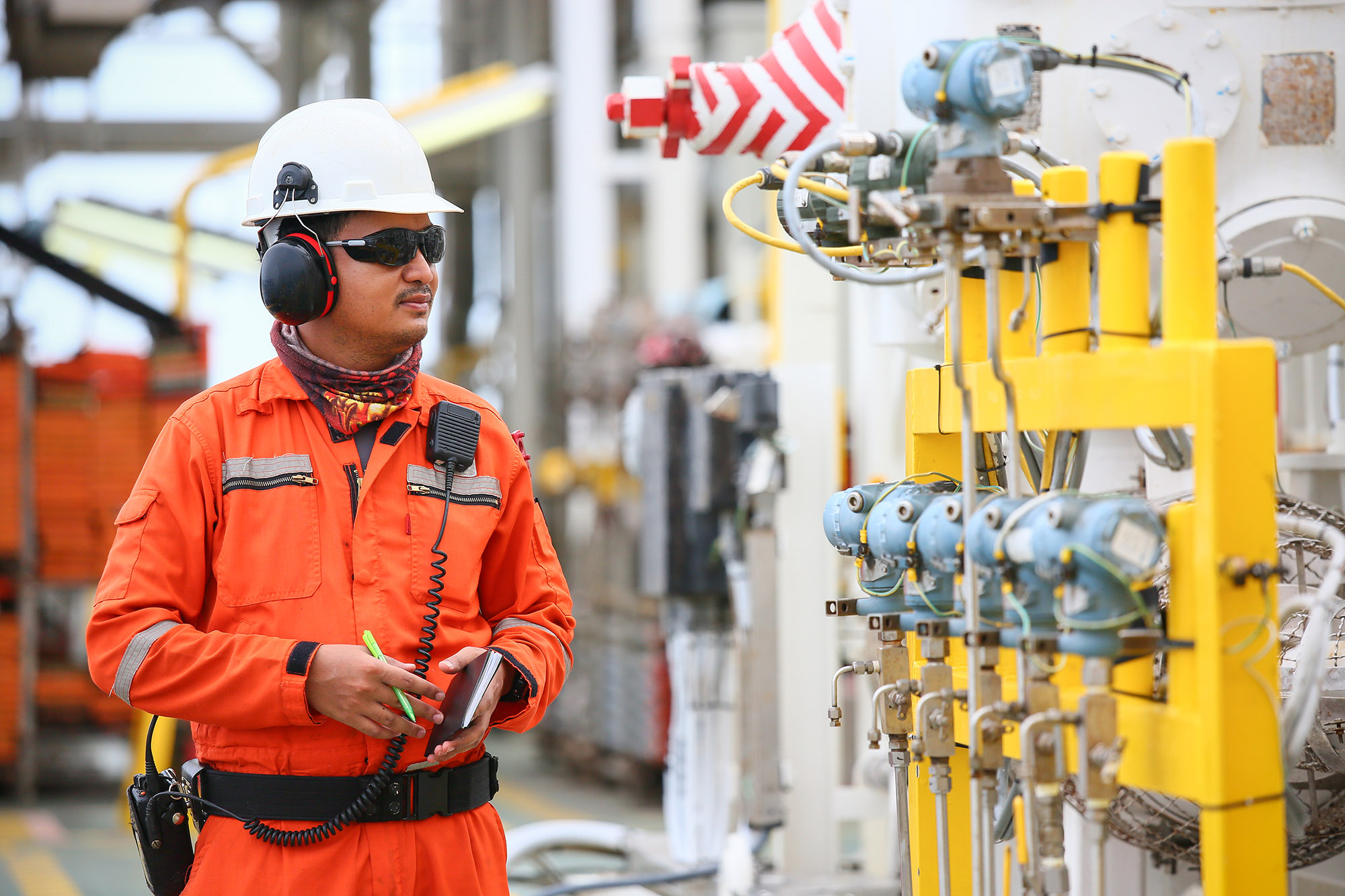 Oil and gas electrician performing safety checks