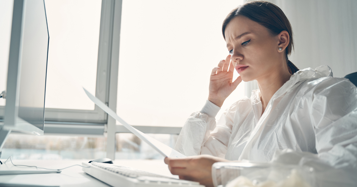 A woman reviewing OnlyFans tax form and business expenses