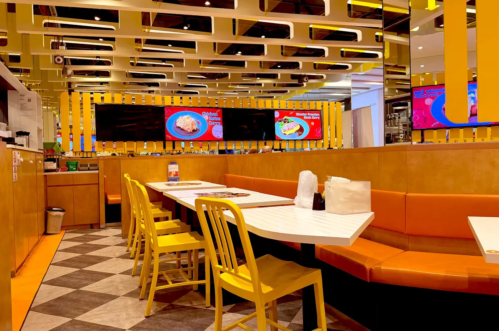 Bright and modern dining area at Monster Planet in Jurong East, known for its Japanese-style curry dishes and family-friendly atmosphere.