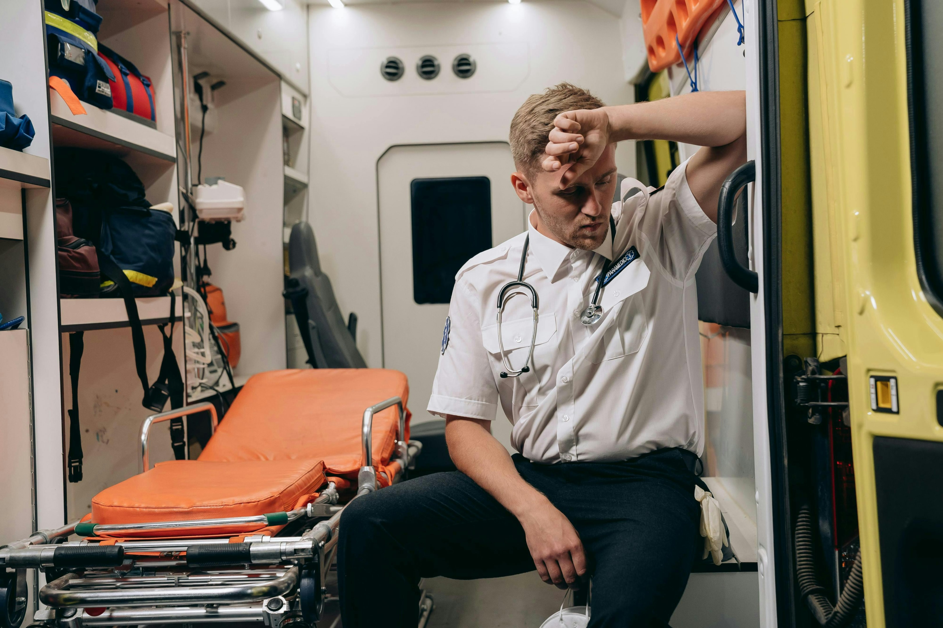 An ambulance stretcher with various necessary equipment.