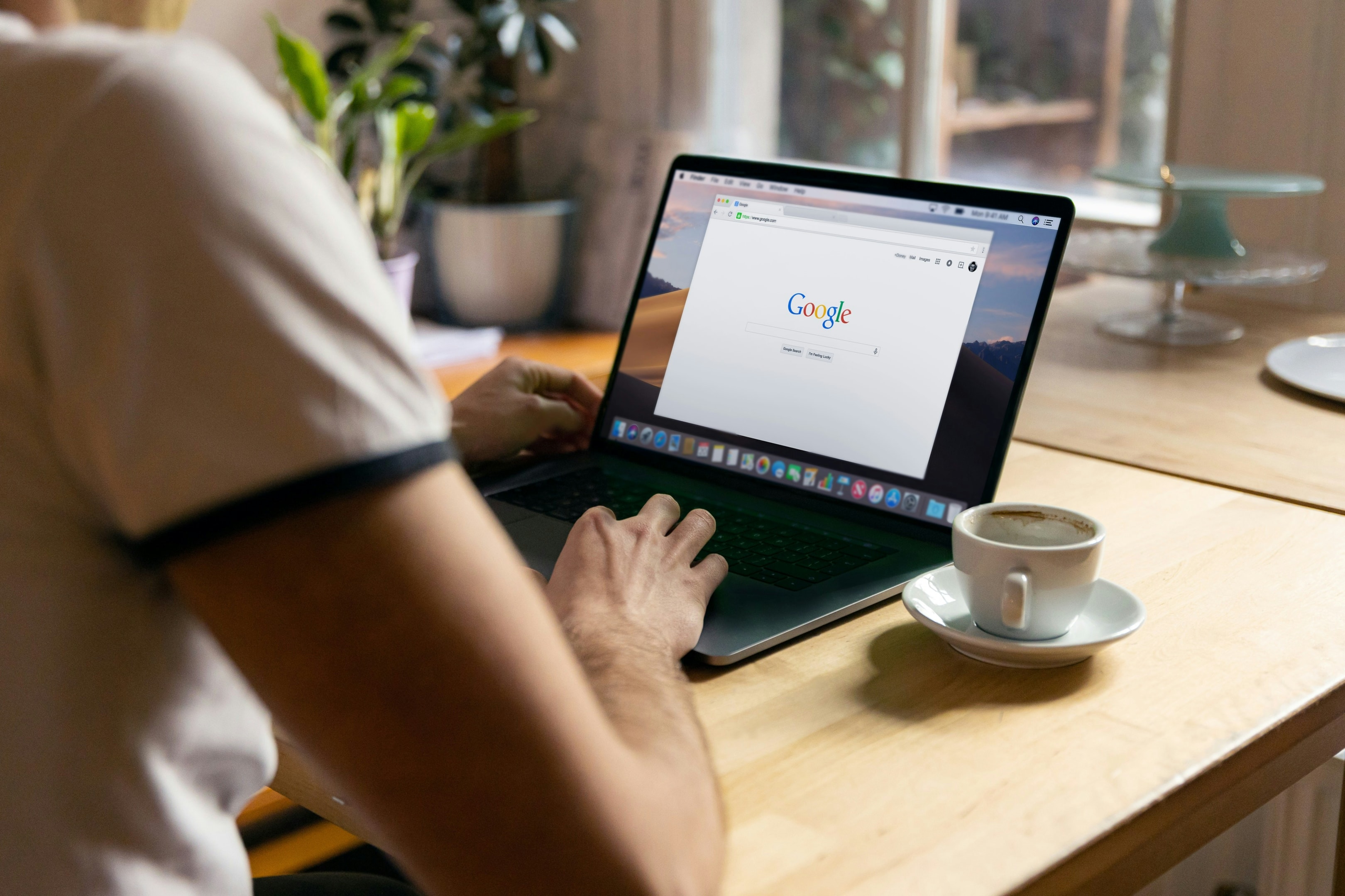 Real estate investor uses laptop for researching keywords for google ad campaign.