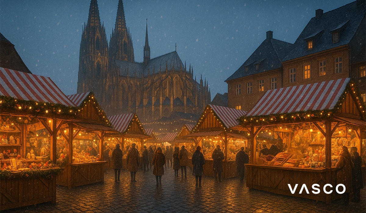 German Christmas market with wooden stalls and a gothic cathedral backdrop