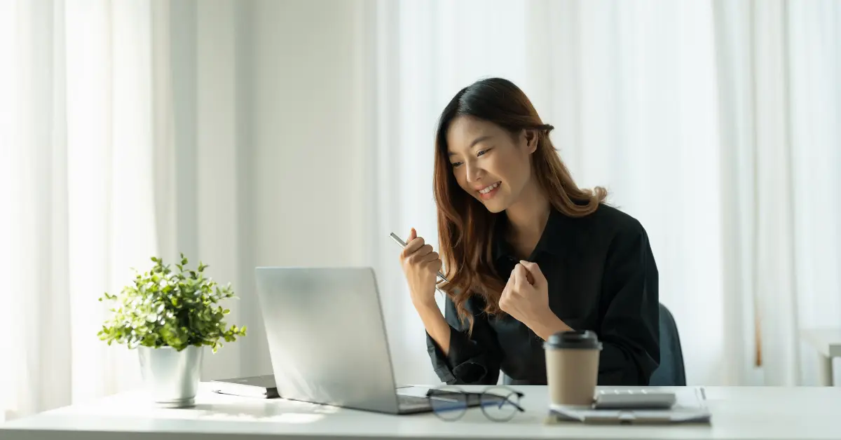 A woman organizing documents to file OnlyFans taxes. 