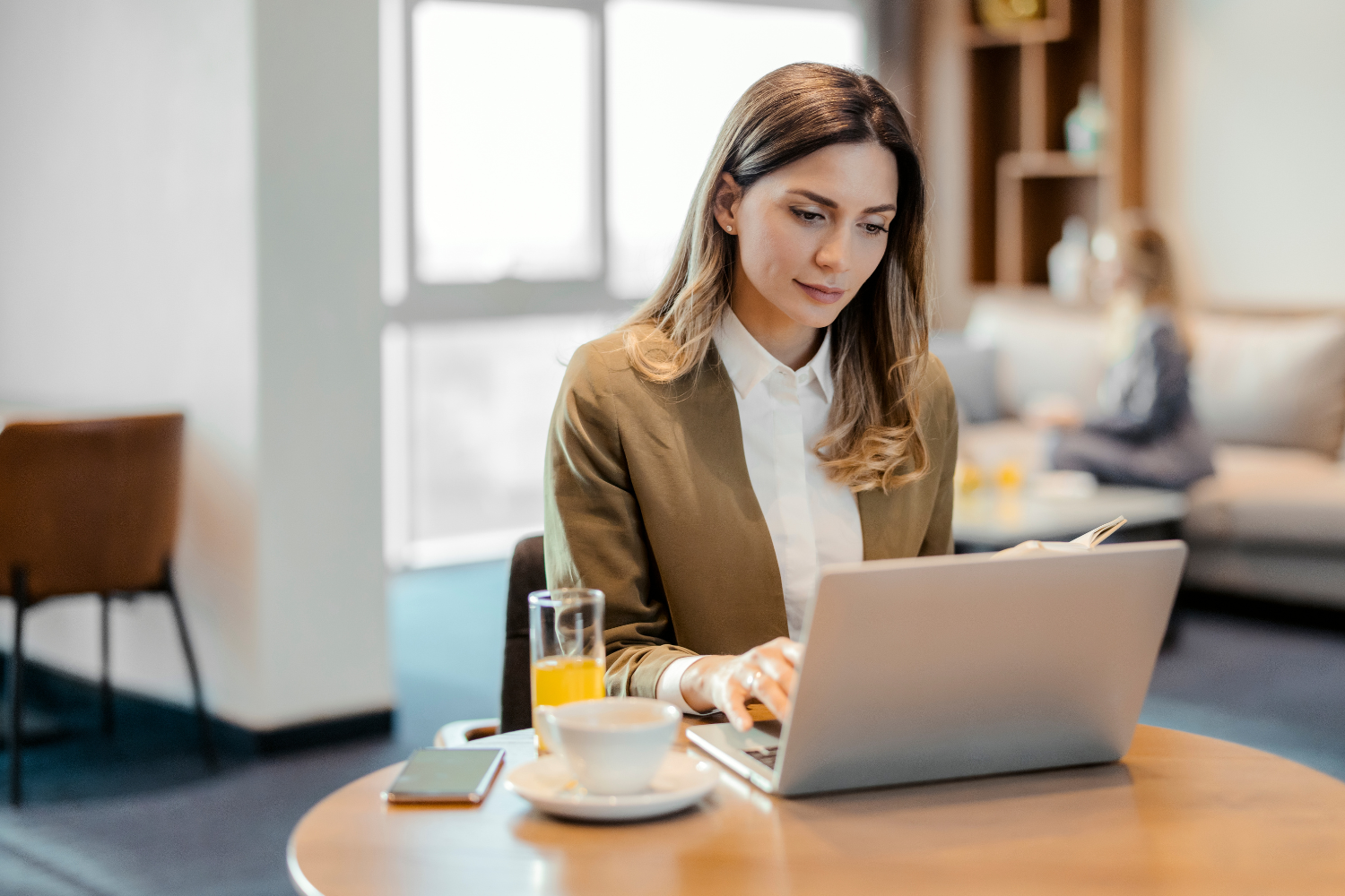 A project manager working on her laptop.