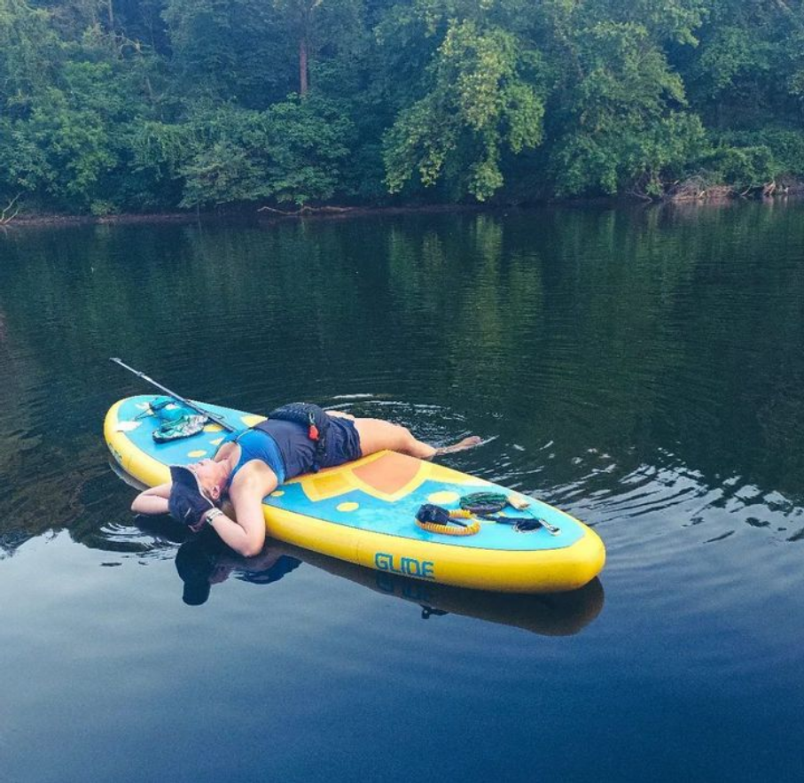 lying on an inflatable paddle board