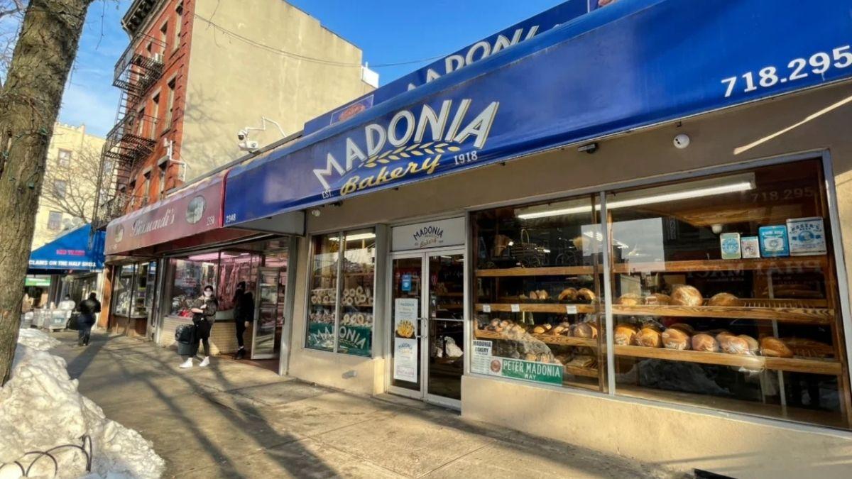 Madonia Bakery exterior showcasing bread and other baked goods in the window