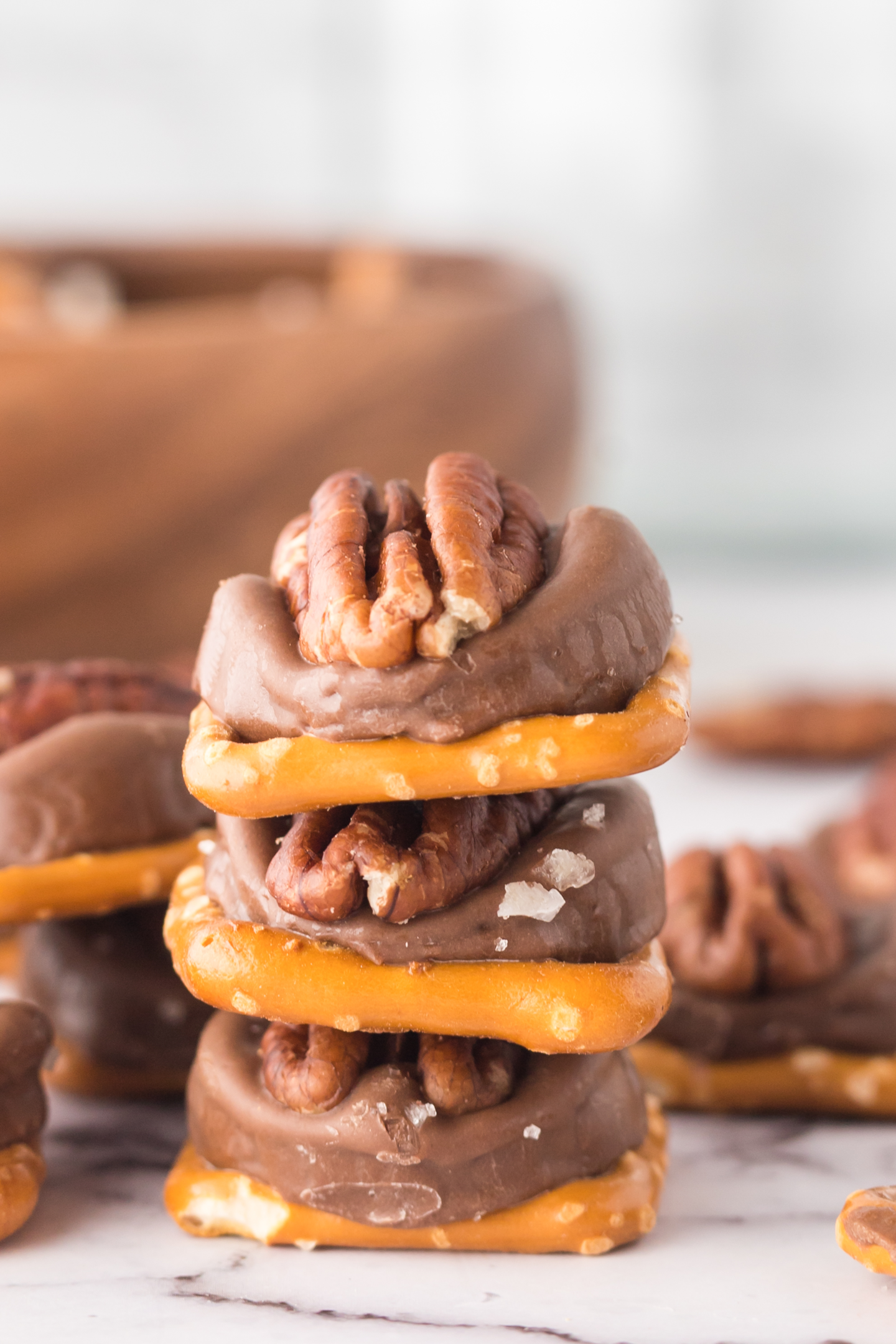 three rolo pretzel turtle candies stacked on top of each other