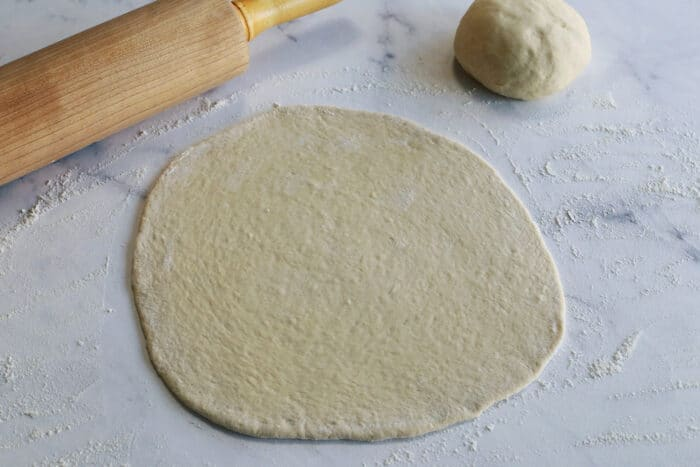 Shaped thin crust pizza dough